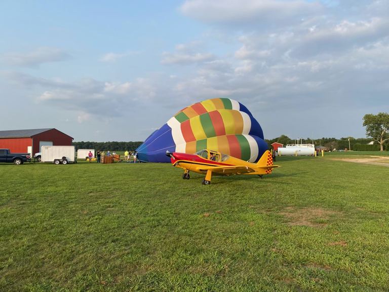 Hot air balloon and airplane at Bucks Airport